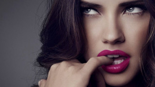 Woman red lipstick hand on - her cheek free wallpaper