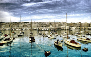 Harbor boats cloudy sky buildings - the background and a man free wallpaper
