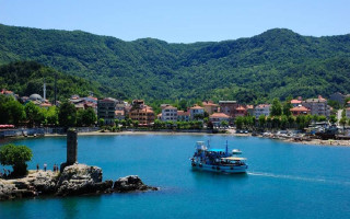 Boat water town mountains background - free ship wallpaper for desktop