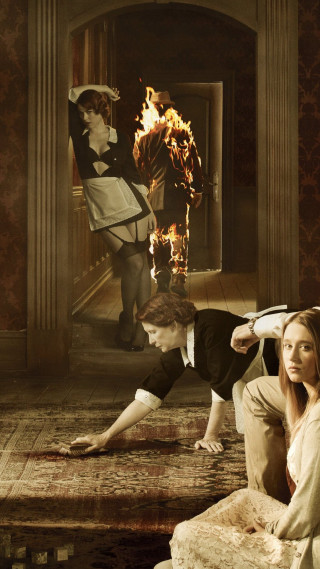 Woman man couch fire background - free halloween wallpaper for mobile