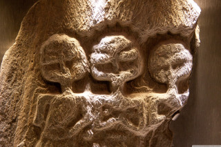 Stone carving group people man - a child free wallpaper