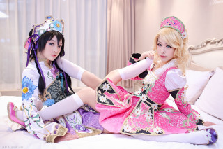 Two women costumes sitting bed - cosplay free wallpaper