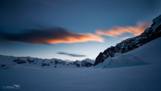 Snowy mountain cloudy sky horizon - snow under a cloudy sky free wallpaper