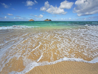 Sandy beach waves island sky 2 - a small island in the distance free wallpaper