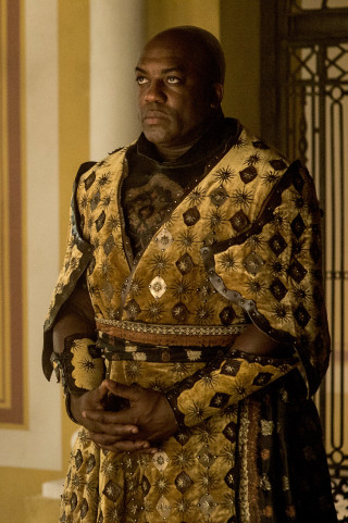 Man yellow black outfit building - bruce onobrakpeya free wallpaper