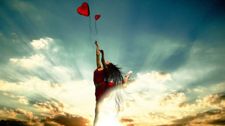 Woman flying kite heart shaped - a kite in the sky free wallpaper