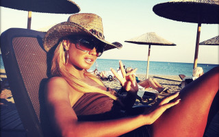 Woman beach hat cellphone sitting - summer free wallpaper