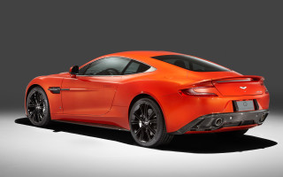 Bright orange sports car studio - a gray background behind free wallpaper