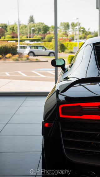 Black sports car parking lot 2 - a black sports car free wallpaper for mobile