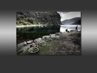 Man lake two bikes person - the shore and a person free wallpaper