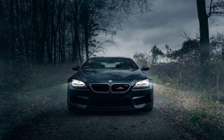 Black car parked road woods - fog free wallpaper