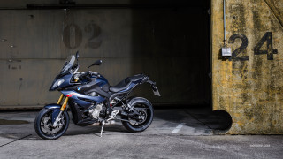 Motorcycle parked parking lot building 2 - a building free wallpaper