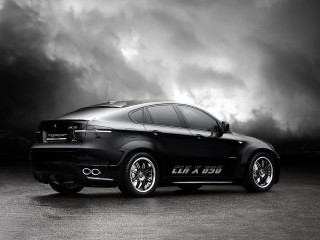 Black car dark cloud sky - a black car free wallpaper