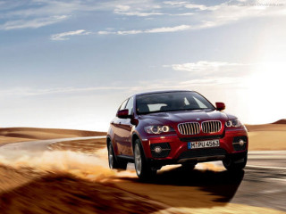 Red bmw suv desert road - the top of the car free wallpaper