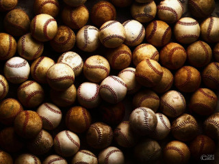 Baseballs pile tabletop black background - free sports wallpaper