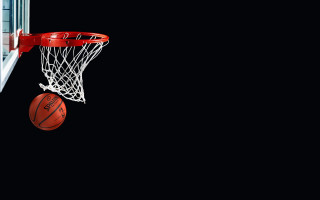 Basketball net hoop dark night 2 - a basketball in the air free wallpaper