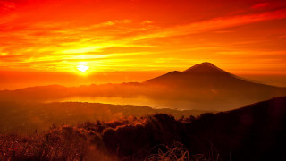 Sunset mountain red sky clouds 2 - a sunset over a mountain free wallpaper