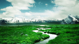 Stream lush field mountains snow 2 - covered free wallpaper