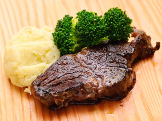 Steak mashed potatoes broccoli wooden - a fork and knife free wallpaper