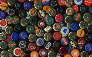 Beer bottle caps stacked together - 2 d sprite free wallpaper