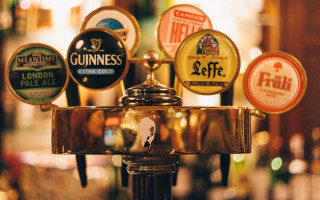 Metal pole beer taps variety - international typographic style free wallpaper for desktop