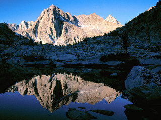 Mountain range lake foreground rocks - a few rock free wallpaper