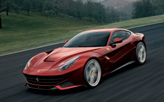 Red ferrari sports car driving - a sunny day free wallpaper