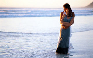Man woman embracing beach sunset - a man and woman free wallpaper