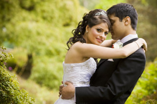 Bride groom embracing garden bushes - a garden area free wallpaper