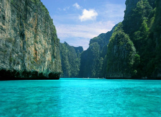 Boat water mountain range cliffs - a boat free wallpaper