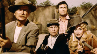 Group people guns hats sitting - a group of people sitting next free wallpaper