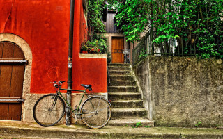 Bicycle red building stairs door - a bicycle free wallpaper