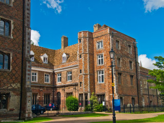 Large brick building clock tower - the top of its free wallpaper
