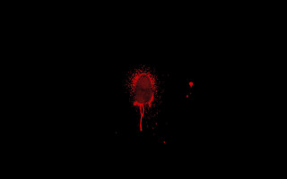 Red splatter black background red - a red light in the middle of the image free wallpaper