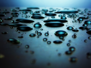 Water droplets blue background light - a surface free wallpaper