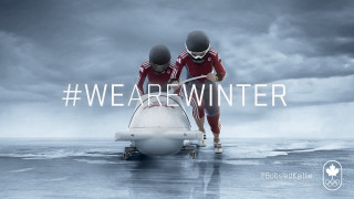 Two people red uniforms plane - a dark sky in the background free wallpaper