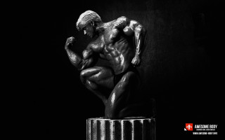 Statue man sitting pedestal dark - arnold free wallpaper