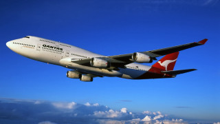 Passenger jet flying blue sky - cloud below free wallpaper