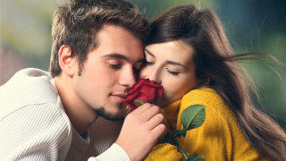 Man woman kissing holding rose 6 - free valentines wallpaper