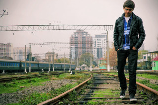 Man standing train track city 2 - daryush shokof free wallpaper