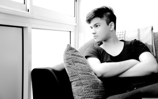 Man sitting couch arms crossed 3 - anthony devas free wallpaper for desktop