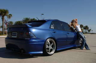 Woman blue car parking lot - the back free wallpaper