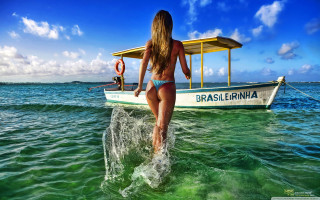 Woman bikini surfboard ocean boat - cinematic free wallpaper