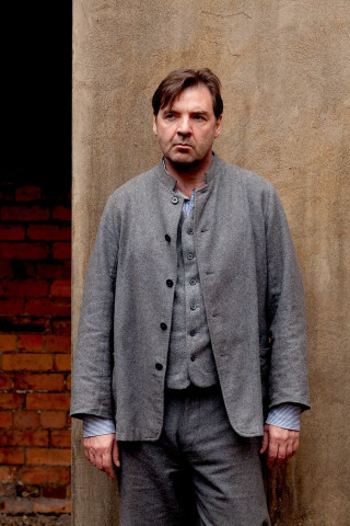 Man suit brick wall standing - david annand free wallpaper for mobile