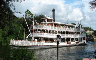 Large boat people river forest - a clock tower free wallpaper