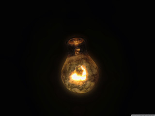 Light bulb glowing yellow reflection - a light bulb free wallpaper
