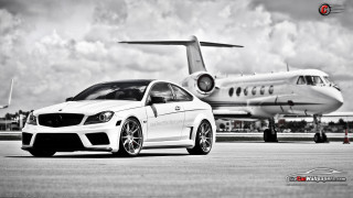 White car parked jet airliner - a plane in the background free wallpaper