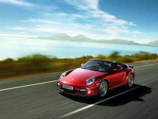 Red sports car driving road 32 - a body of water and mountains free wallpaper
