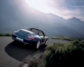 Blue sports car mountains trees - annie leibovitz free wallpaper