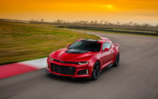 Red chevrolet camaro race track - the sun setting behind free wallpaper